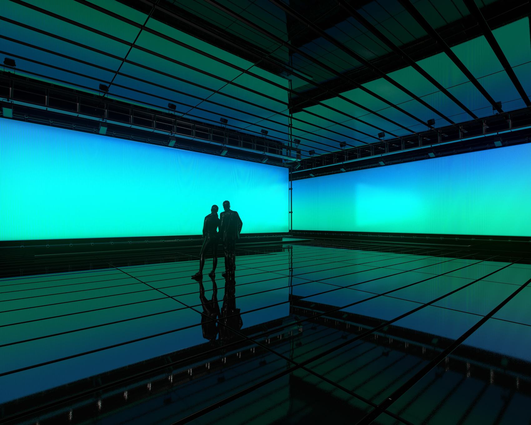 Two figures inside a vast LED volume washed in green and blue